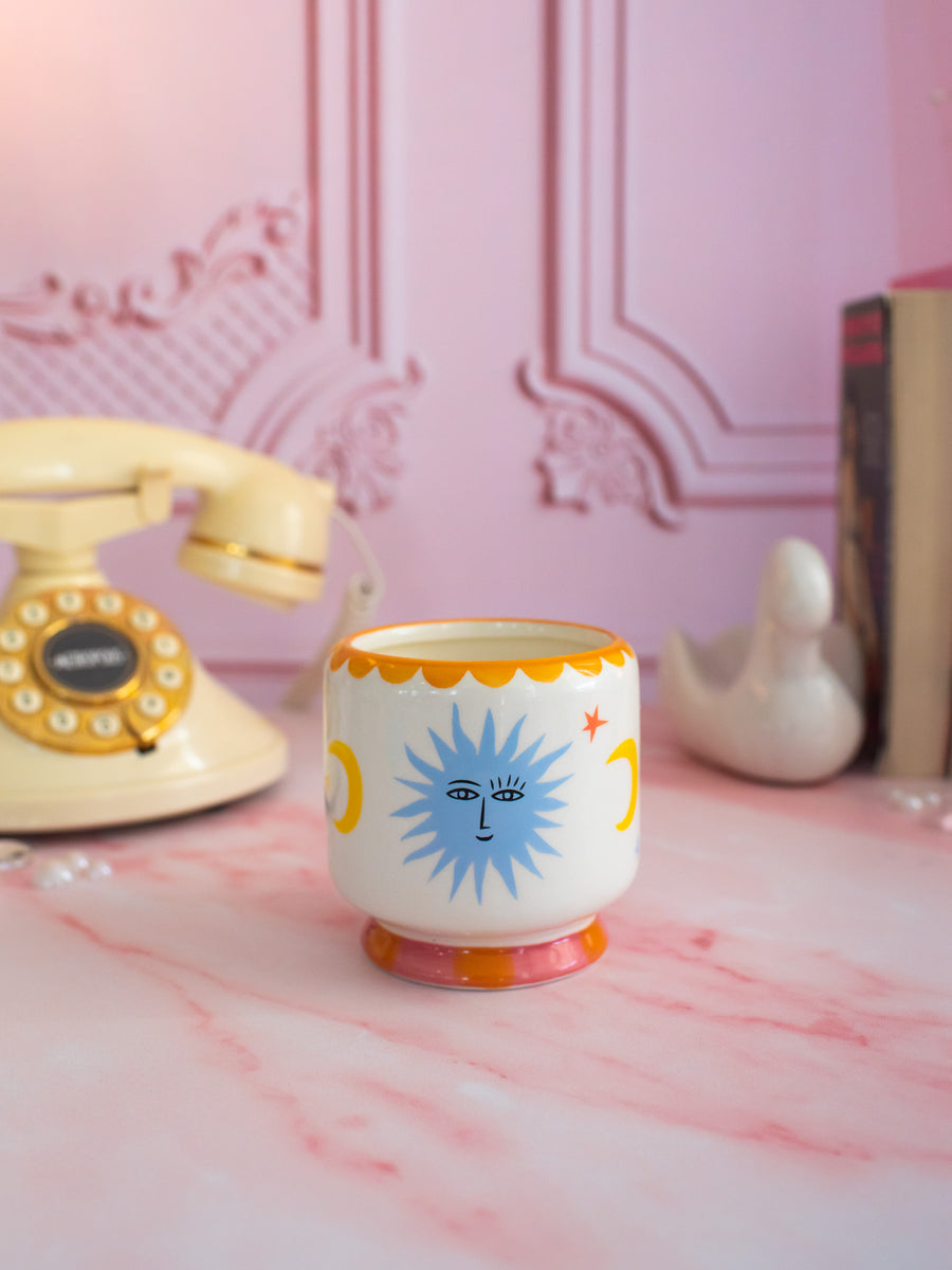 A Dopo 8 oz Handpainted Sun Ceramic Candle-  Orange Blossom